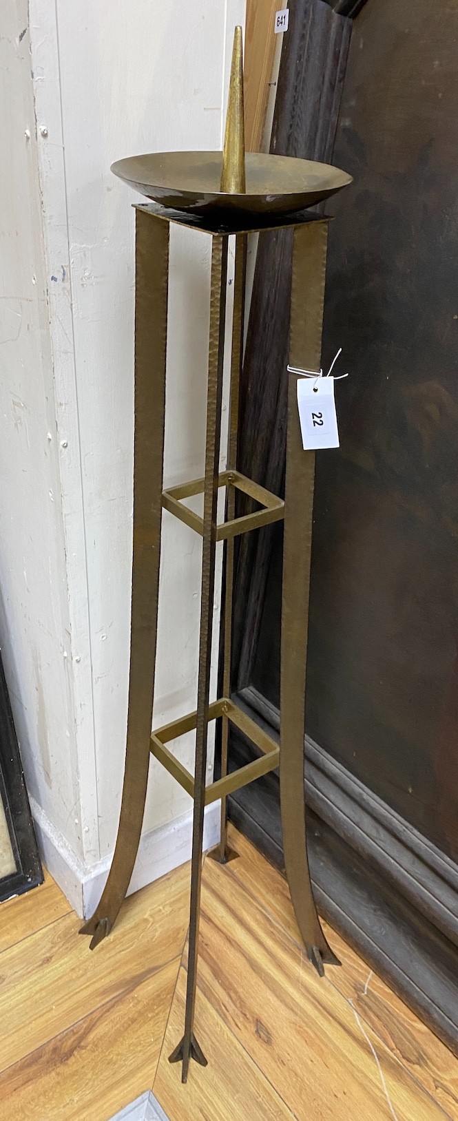A brutalist bronze pricket candlestick, height 120cm